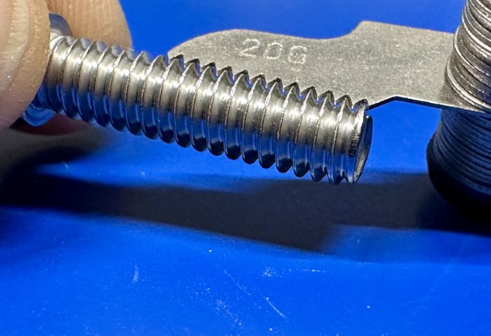 Closeup of thread gauge measuring a 1/4-20x1" socket head cap
screw