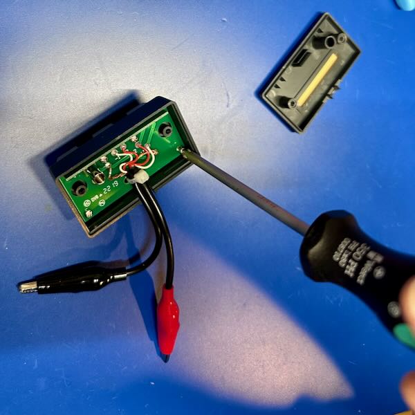 Screwdriver removing internal PCB screws from
TL-21